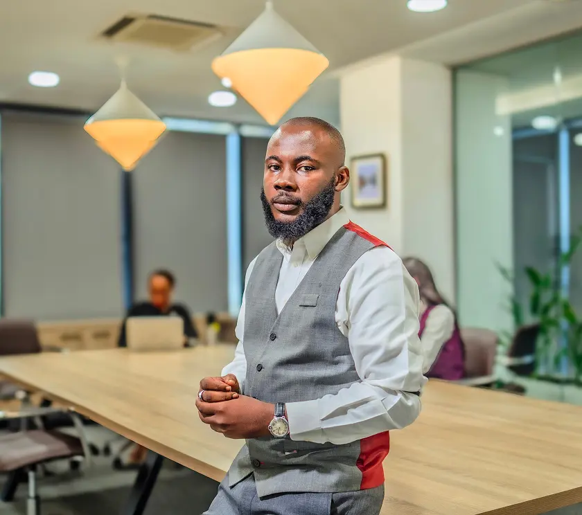 A Meristem professional standing in an office meeting room