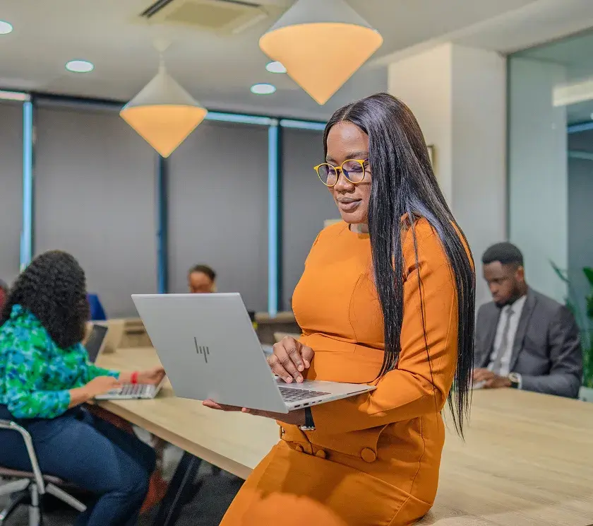 A Meristem professional seated with a laptop